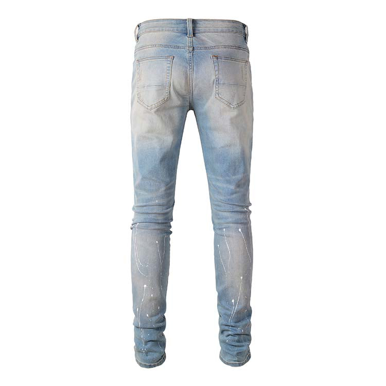 Jeans bleu déchire avec trace de peinture et surpiqûre noir