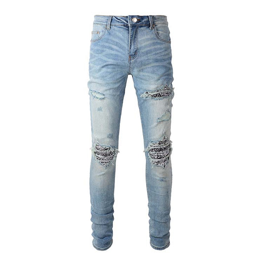 Jeans bleu délavé déchire avec patch motif en surpiqure