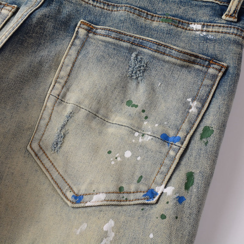 Jeans délavé bleu déchire avec patch et éclat de peinture