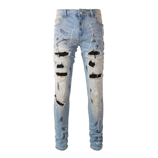 Jeans bleu déchire avec trace de peinture et surpiqûre noir