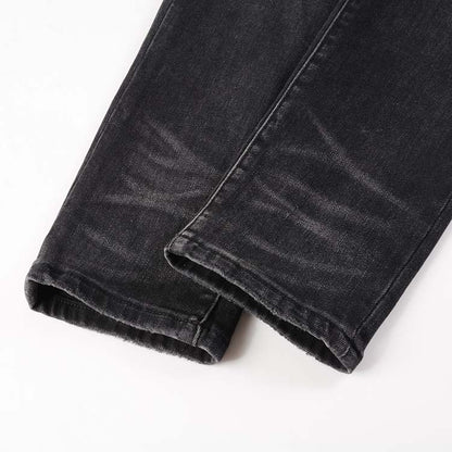 Jeans noir déchire avec patch rose surpiqûre