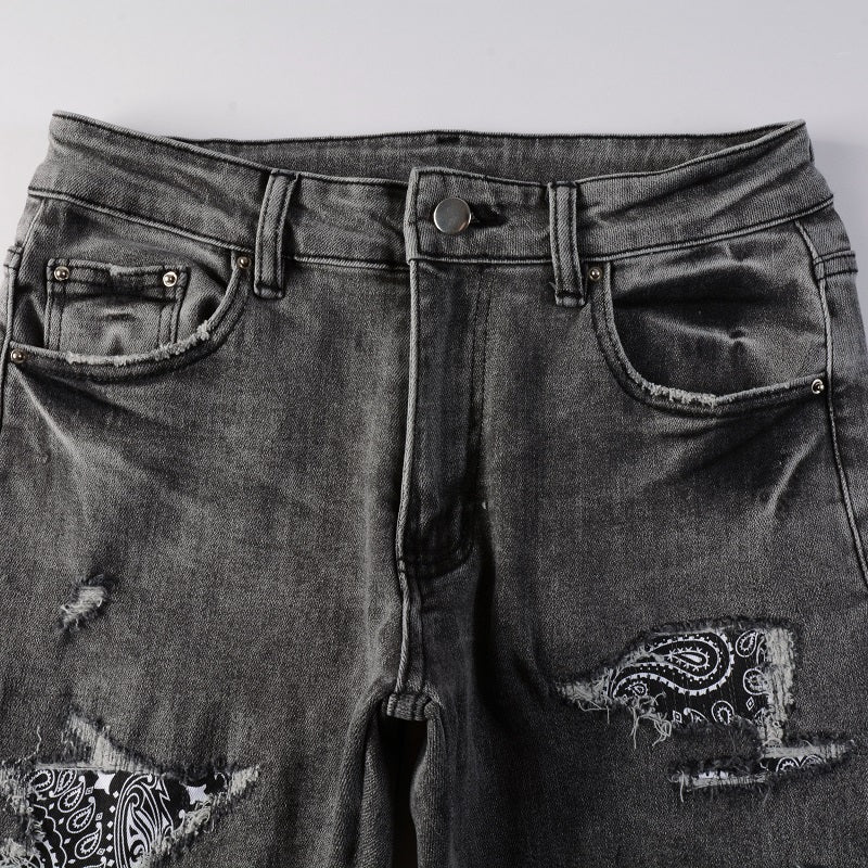 Jeans gris déchire à patch avec dessin