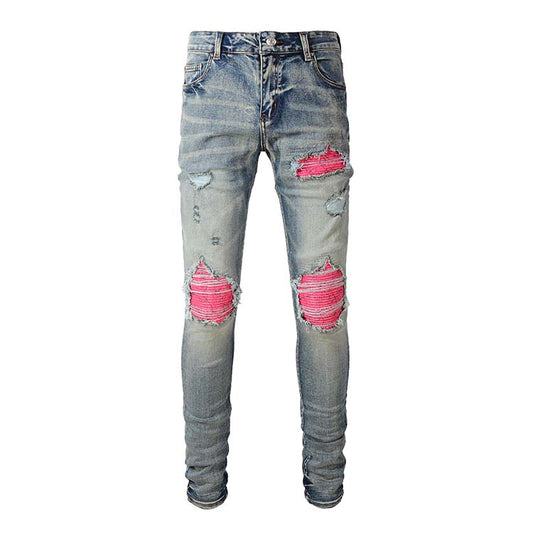 Jeans bleu délavé déchire avec patch rose surpiqûre