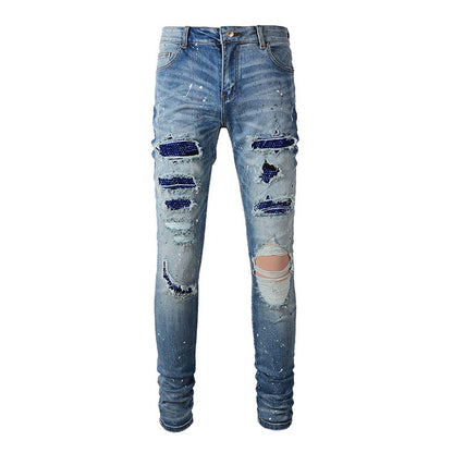 Jeans bleu délavé déchire avec surpiqûre bleu strass