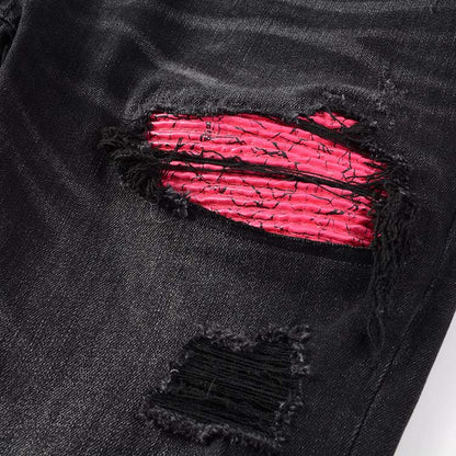 Jeans noir déchire avec patch rose surpiqûre