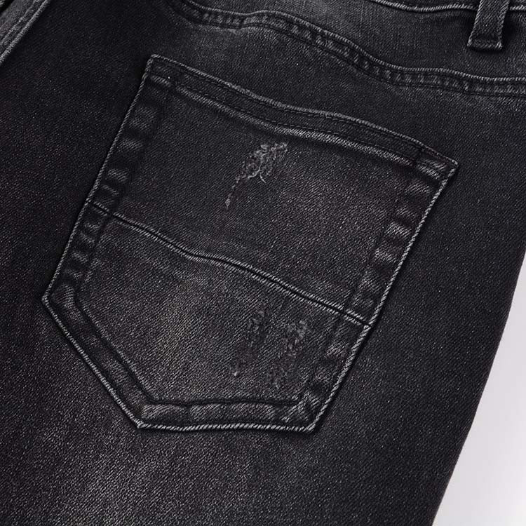 Jeans noir déchire avec patch rose surpiqûre