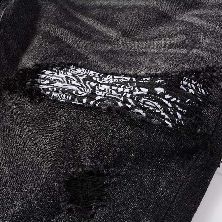 Jeans noir déchire avec patch dessiner