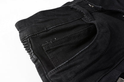 Jeans biker noir poche discrète