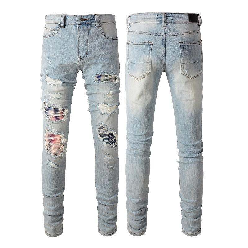 Jeans bleu clair déchire avec patch motif colore en surpiqure