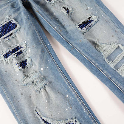 Jeans bleu délavé déchire avec surpiqûre bleu strass