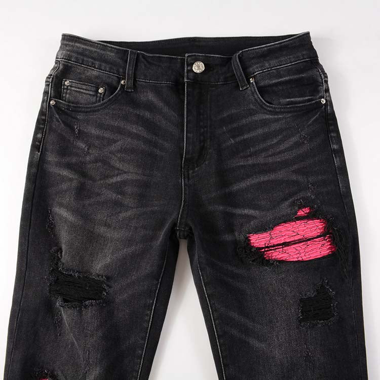 Jeans noir déchire avec patch rose surpiqûre