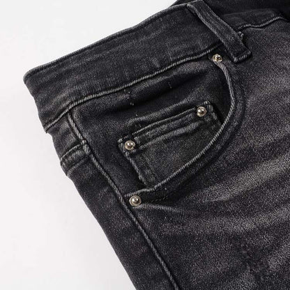 Jeans noir déchire avec patch dessiner