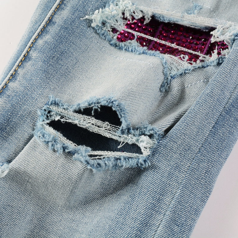 Jeans bleu déchire patch en strass