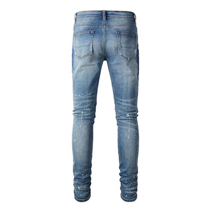 Jeans bleu délavé déchire avec surpiqûre bleu strass