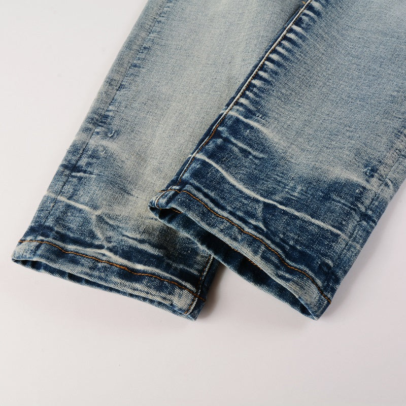 Jeans bleu déchirure avec patch en tissus