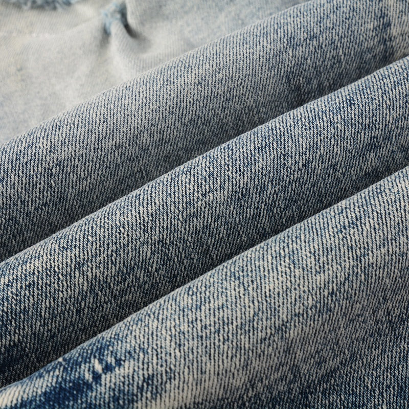 Jeans bleu déchirure avec patch en tissus