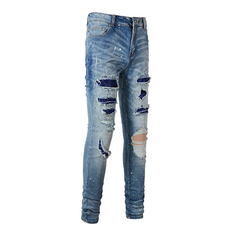 Jeans bleu délavé déchire avec surpiqûre bleu strass