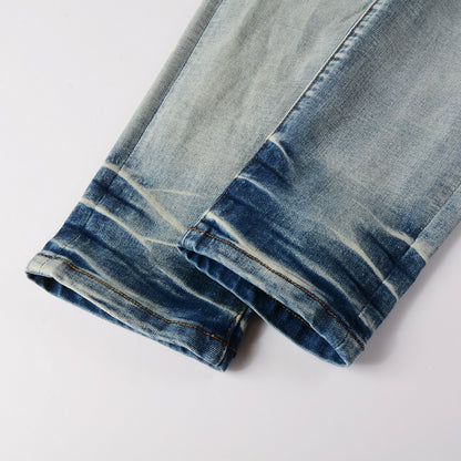 Jeans bleu clair délavé déchire avec surpiqûre noir